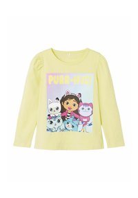 Langarmige gele katoenen shirt met een kleurrafische afbeelding van cartoonfiguren en de tekst "PURR-IFIC!" op de voorkant.