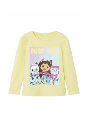 Langarmige gele katoenen shirt met een kleurrafische afbeelding van cartoonfiguren en de tekst "PURR-IFIC!" op de voorkant.