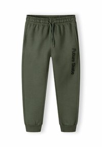 Pantalones de chándal verdes de algodón con cintura elástica, bolsillos laterales y puños ajustados. Presenta la impresión "Future Skate" en negro en el lateral.
