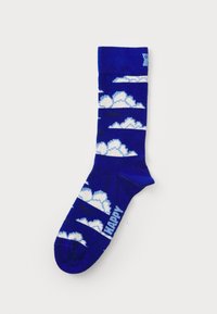 Socks featuring a blue background with white cloud patterns and black accents. Knit design with ribbed cuff and toe. Text reads "HAPPY."