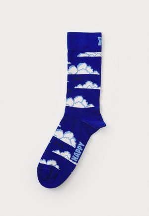 Socks featuring a blue background with white cloud patterns and black accents. Knit design with ribbed cuff and toe. Text reads "HAPPY."
