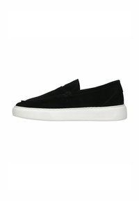 Black suede slip-on shoes with a white rubber sole, featuring a smooth texture and stitched detailing along the edges.