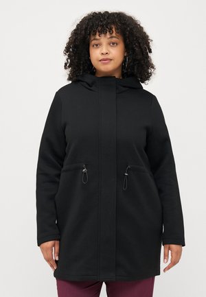 Black hooded coat with a zip front, two front pockets, cinching details, and a soft, textured fabric. Designed for comfort and warmth.