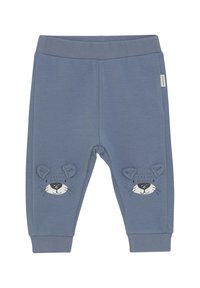 Blaue Baumwollesweatpants mit glatter Textur, featuring einem bedruckten Löwenkopf-Design und 3D-Ohrenakzenten an den Unterschenkeln. Elastischer Bund.