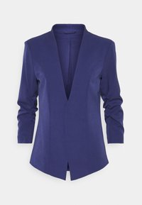 Veste bleu marine avec un col en V profond, manches longues et coupe ajustée ; présente une texture subtile et une fente au dos pour plus de mobilité.