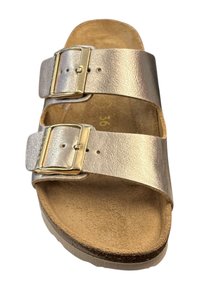 Metallic gold slide sandal with two adjustable buckles, cork footbed, and textured sole. Features a smooth finish and neutral color scheme.
