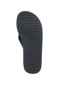 Semelle de sandale en caoutchouc noir avec un motif de texture antidérapant, une forme légèrement courbée et des bords arrondis pour une meilleure traction et durabilité.
