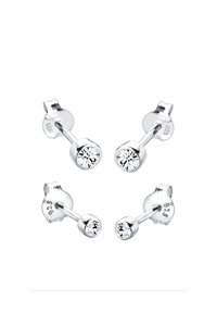 Pendientes de plata con tachuelas y cristales transparentes redondos, con un diseño sencillo y un acabado pulido. Sellados con 925 para garantizar la calidad de la plata de ley.