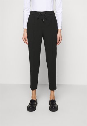 Filippa K Pantalones - black
