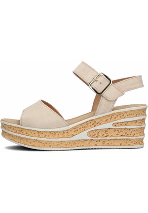 Beige suede wedge sandals with a peep toe, adjustable ankle strap, and a textured cork platform. White accents on the wedge design.