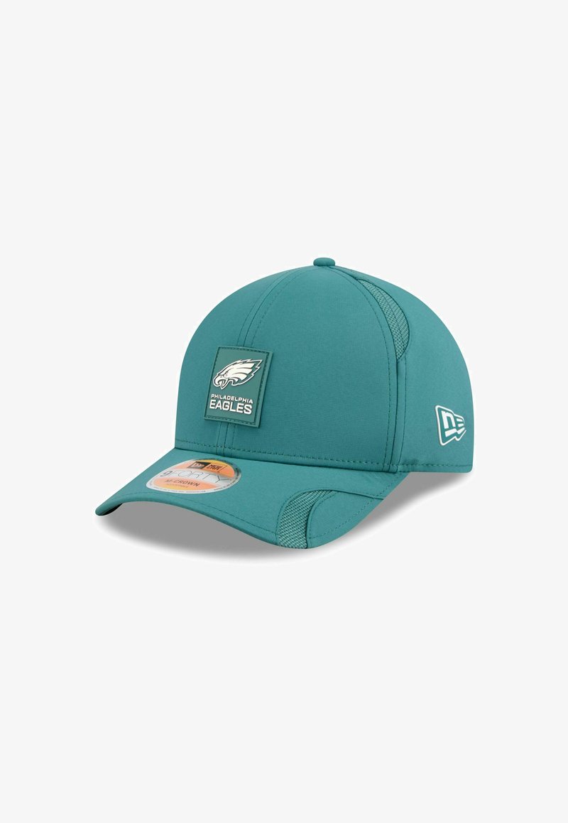 Teal baseball cap with a fitted design, featuring a Philadelphia Eagles logo patch on the front and mesh accents on the sides.