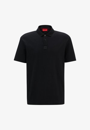 Black polo shirt made of smooth fabric with a classic collar, three-button placket, and a textured logo detail on the chest.