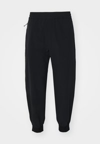 PURSUIT ROBERT - Tracksuit bottoms - black