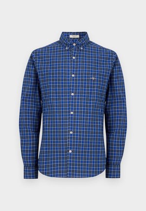 Long-sleeve blue checkered shirt with button-down collar, white buttons, and small logo on left chest. Cotton material, relaxed fit.