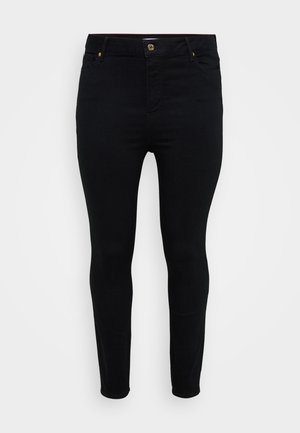 Czarne dżinsy typu skinny o dopasowanym kroju, z złotymi elementami na przednich i tylnych kieszeniach oraz gładką fakturą.