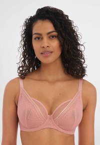 Soutien-gorge rose avec des accents en mesh, des motifs géométriques, un soutien-gorge à armatures et des bretelles ajustables. Tissu doux avec une texture lisse.