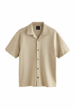 Camicia beige a maniche corte realizzata in tessuto morbido, con chiusura frontale con bottoni, colletto classico e trama sottile.