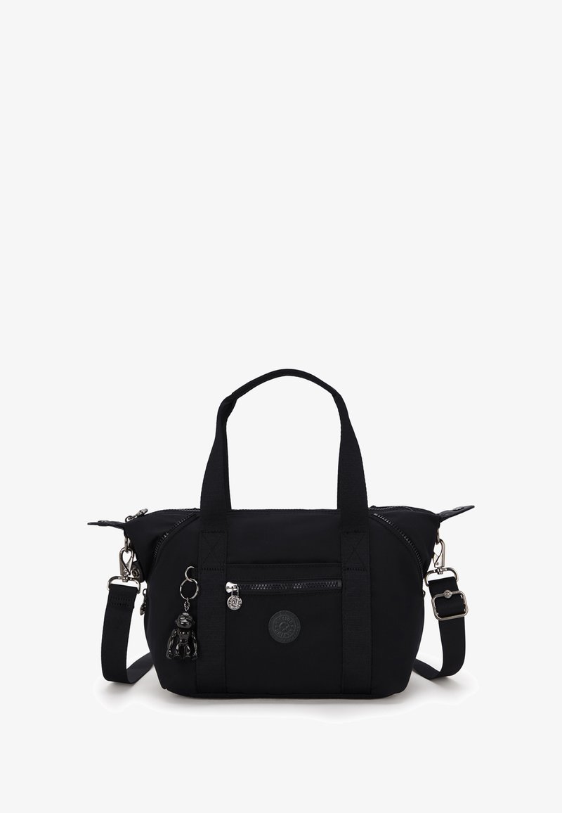 Black nylon handbag with dual top handles and an adjustable shoulder strap. Features zippered pockets, logo patch, and a decorative charm.