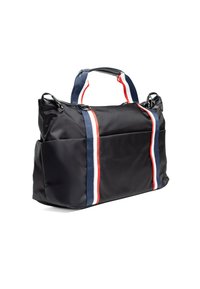 Sac en nylon noir avec poignées supérieures doubles, doté de grandes poches extérieures et de rayures verticales bleues, rouges et blanches de chaque côté.
