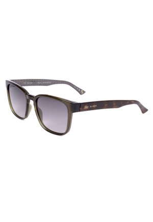Occhiali da sole quadrati color tartaruga scura con lenti sfumate e aste interne decorate, marchiati Ted Baker sul lato.