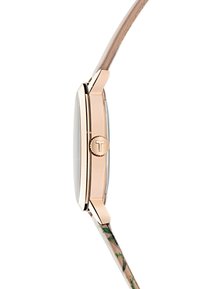 Reloj de pulsera en oro rosa con esfera redonda, cristal de vidrio y una correa de cuero delgada con un patrón floral, que muestra una textura suave y un diseño elegante.