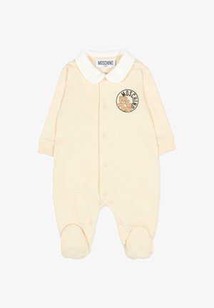 Body pour bébé couleur crème avec col blanc, boutons-pression à l'avant, jambes couvertes et logo ours en peluche avec le texte "Moschino" sur la poitrine.