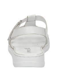 Bílé kožené sandály s otevřenou patou, několika pásky a nastavitelnou sponou. Hladká stélka a bílá gumová podrážka s detaily šití.