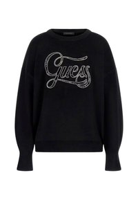 Felpa nera con scollatura rotonda, vestibilità over size e maniche lunghe, con un logo argentato scintillante "Guess" sulla parte anteriore.