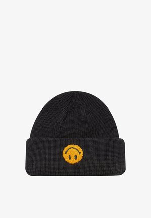 Musta neulottu pipo, jossa on tasainenlahje. Edessä on brodeerattu keltainen hymyilevä naama -kuvio. Pehmeä kangas, ribbaattu materiaali.