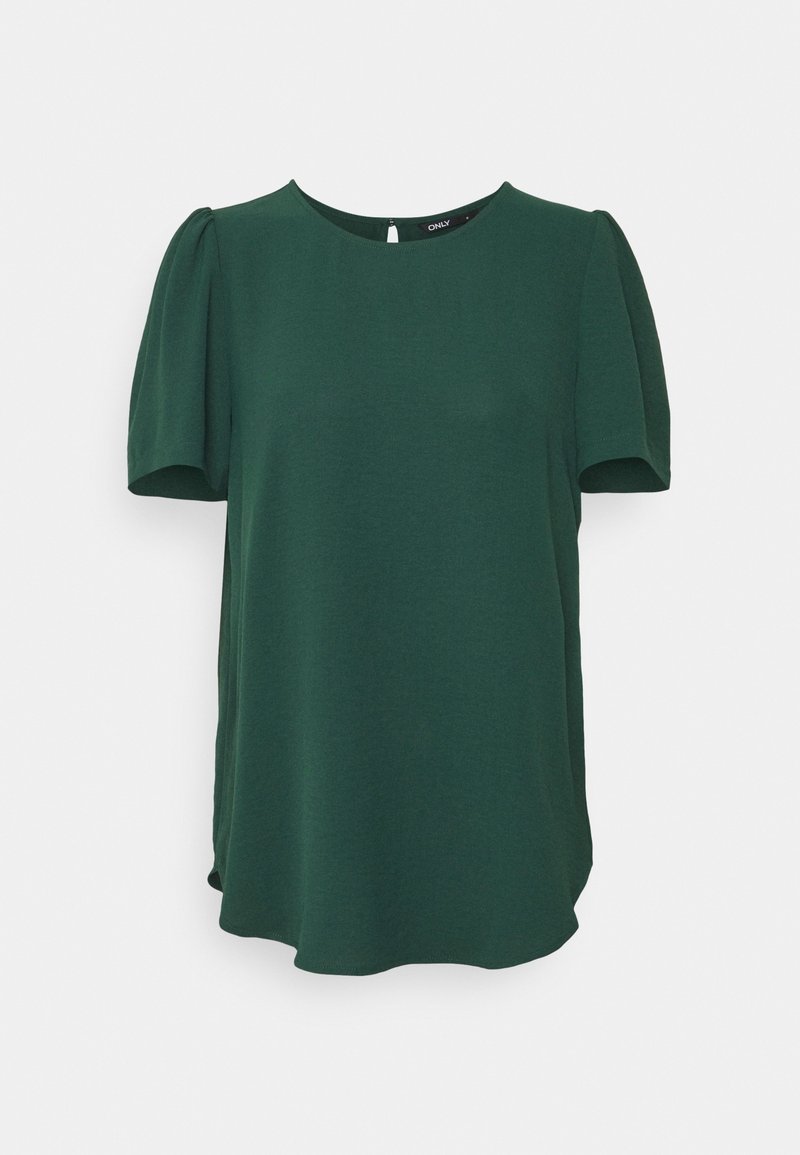 Blouse à manches courtes vert foncé avec col rond et manches légèrement bouffantes, suspendue sur un fond clair uni.