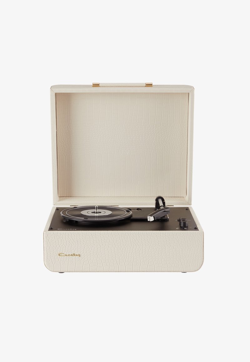 Portable record player with a textured cream exterior, black turntable, and gold hardware accents. Features control knobs on the side.