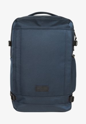 Prostokątny ciemnoniebieski plecak z teksturą, z górnym uchwytem, bocznymi paskami kompresyjnymi oraz środkową przednią metką z logo Eastpak.