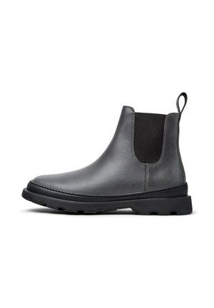 Botas de tobillo de cuero gris con un acabado suave, paneles laterales elásticos y una suela de goma negra texturizada. Presentan una lengüeta para facilitar el calzado.
