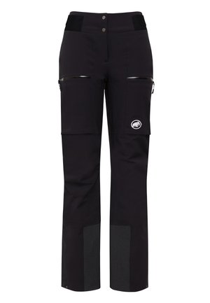 Black outdoor pants with a high waist, front pockets with zippers, and patterned textured lower panel. Features a logo patch on the hip.