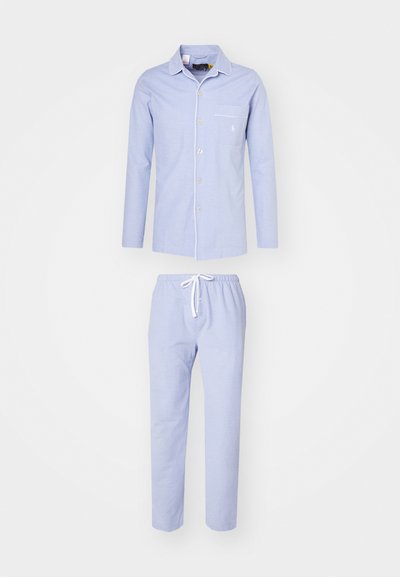 Light blue pajama set featuring a long-sleeve button-up shirt with a pocket and matching drawstring pants, made of soft fabric.