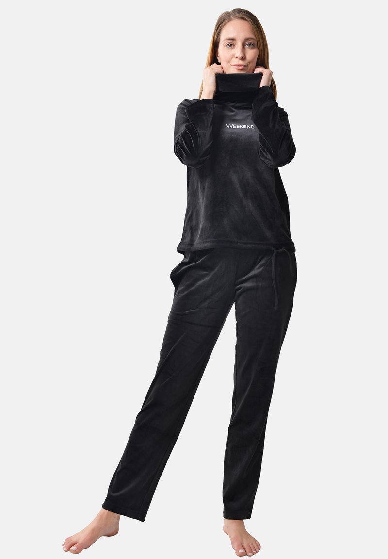 Black velvet loungewear set featuring a mock turtleneck top with “WEEKEND” text, and matching pants with an adjustable drawstring.