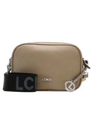 Beige textured leather crossbody bag with black adjustable strap, silver L.CREDI logo, and round silver metal charm attached to zipper pull.