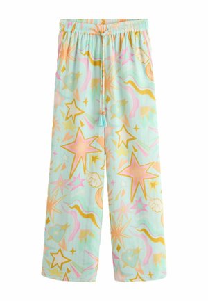 Svetlomodré široké nohavice s elastickým pásom, šnúrkami s strapcami a farebnými vzormi hviezd, oblakov, mesiaca a vlnovitých čiar v ružovej, oranžovej a žltej farbe.