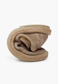 Brown wool slipper, rolled up; features textured fabric, braided jute trim, soft padding, and a smooth sole. Compact and lightweight design.