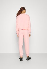 Puma LOUNGEWEAR SUIT - Tuta - peach smoothie