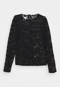 Black long-sleeve top made of lace featuring a textured pattern with varied shapes and letters. Crew neck design with a fitted silhouette.