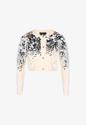 Cremfarbener kurzer Cardigan mit langen Ärmeln, Frontknöpfen, kleinen Taschen und silbernen Pailletten, die dicht die Schultern und Oberarme bedecken.