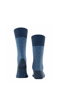Calzini blu navy con un motivo geometrico in blu chiaro. Copri-caviglia a coste, texture liscia, talloni e punte rinforzati. Logo del marchio alla base.