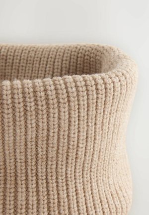 Beige knitted basket with a soft texture, featuring a ribbed pattern and a wide open top, showcasing rounded edges and a sturdy design.