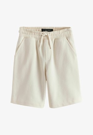 Pantaloni scurți din bumbac de culoare crem, cu talie elastică, șnur și buzunare laterale, inscripționați cu "LOOSE" pe partea interioară a taliei.