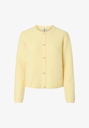 Geel geribd cardigan met een ronde halslijn, zeven knopen en kleine strikaccenten. Zachte textuur met lange mouwen.