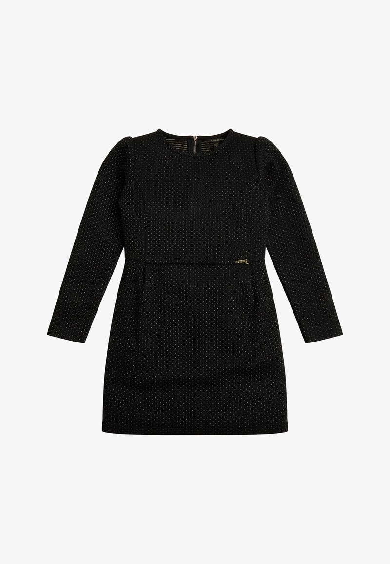 Mini-robe noire à manches longues avec petits pois blancs, col rond et un petit détail décoratif de fermeture éclair près de la taille.