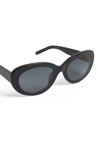 Sorte solbriller med en overdimensioneret oval ramme, mørke gradient linser og elegante, brede stænger. Fremstillet af glat plastmateriale.