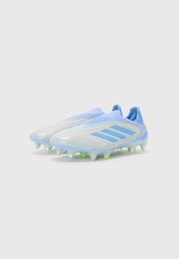 Light blue soccer cleats with a smooth synthetic upper, featuring textured mesh areas and white studs on a translucent outsole. Three stripes design.