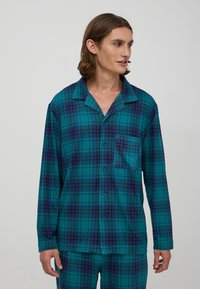 Turkusowy i granatowy wzór w kratę, długi rękaw, zestaw piżam z kołnierzykiem typu notch i kieszenią. Wykonany z miękkiego materiału, z zapięciem na guziki i luźnym krojem.